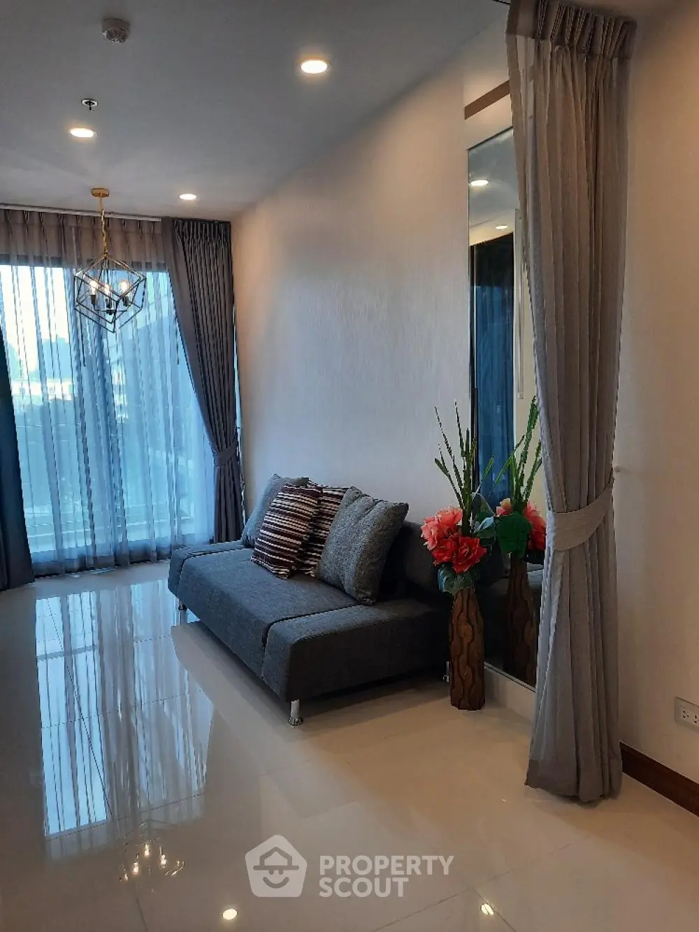 Elegant living room with modern decor and large window view