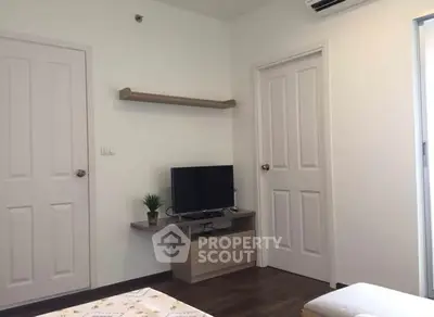 Modern living room with TV and minimalist decor