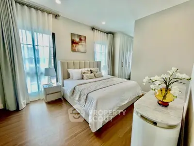 Elegant bedroom with modern decor and natural light