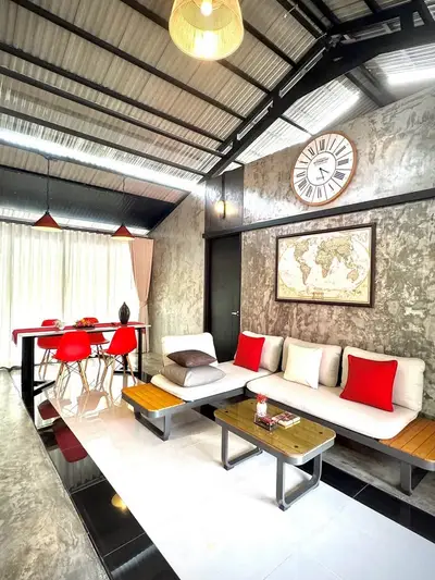 Stylish industrial living room with modern decor and vibrant accents