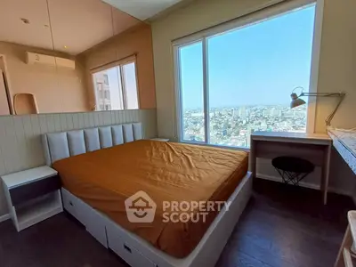 Spacious bedroom with stunning city view and modern furnishings