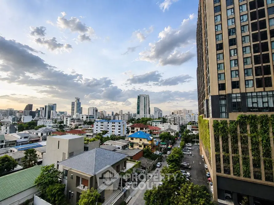 Stunning cityscape view from a high-rise building showcasing urban skyline and vibrant neighborhood.