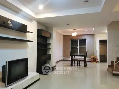Spacious modern living room with sleek decor and dining area