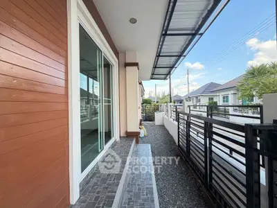 Modern house exterior with sleek design and spacious balcony