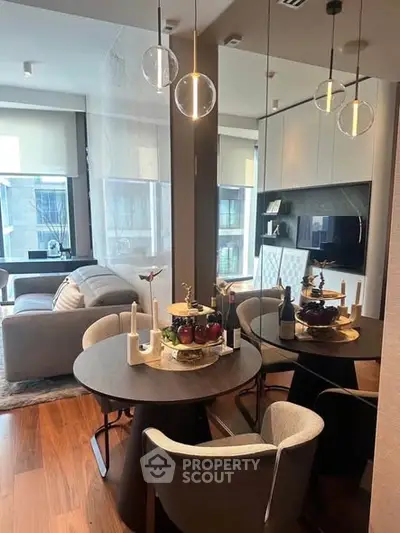 Modern living room and dining area with stylish furniture and decor