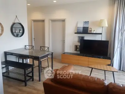Modern living room with stylish furniture and TV setup, perfect for relaxation and entertainment.