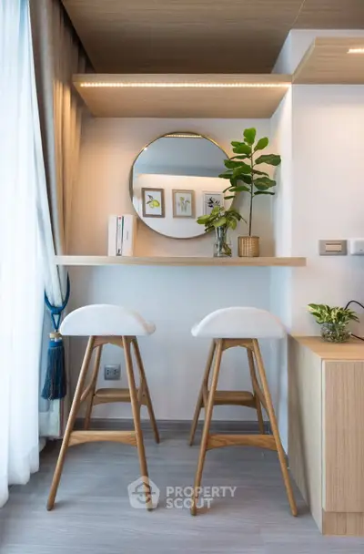 Stylish modern living room with elegant bar stools and decorative mirror