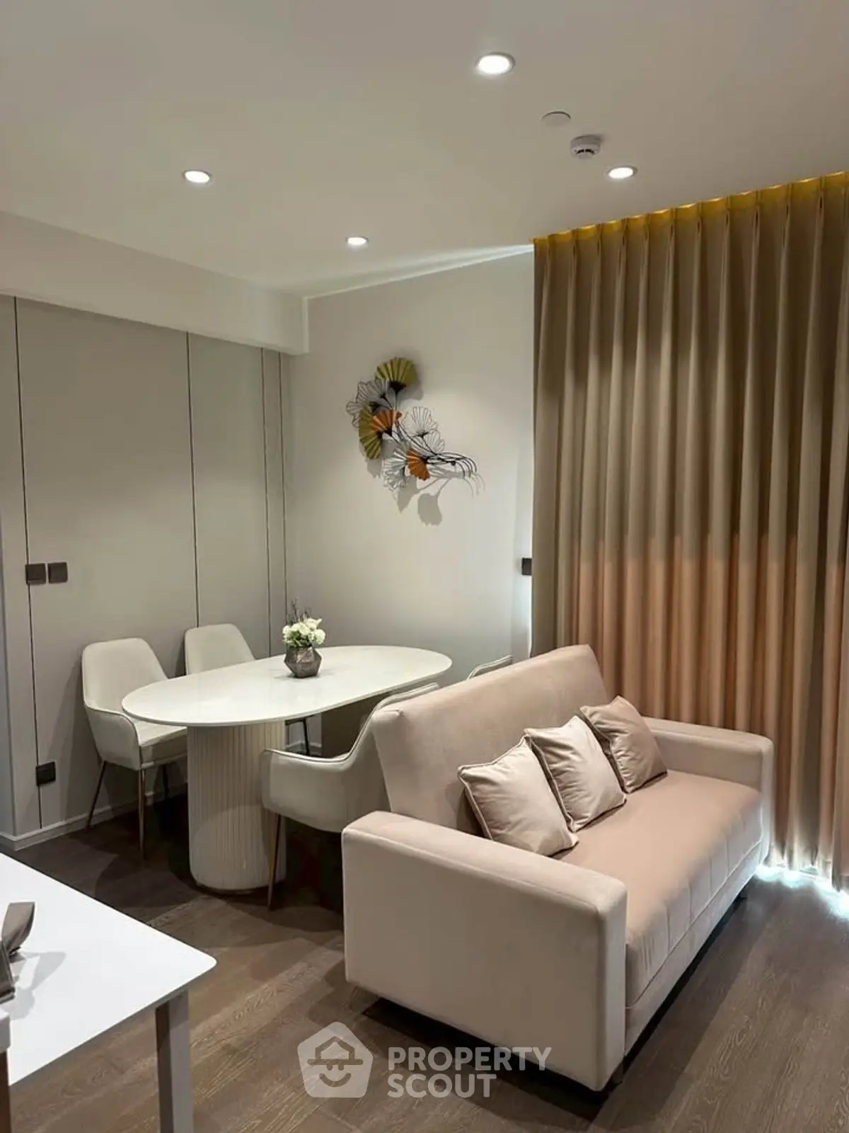 Modern living room with elegant decor and cozy seating area, perfect for relaxation and entertaining.