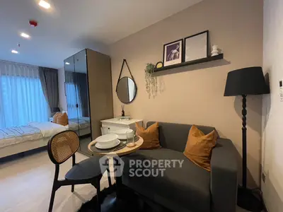 Modern studio apartment with cozy living area and stylish decor