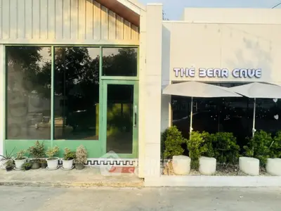 Charming storefront with large windows and outdoor seating at The Bear Cave.