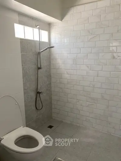 Modern bathroom with sleek shower and elegant tile design