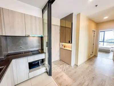 Modern open-layout kitchen with sleek cabinetry and city view