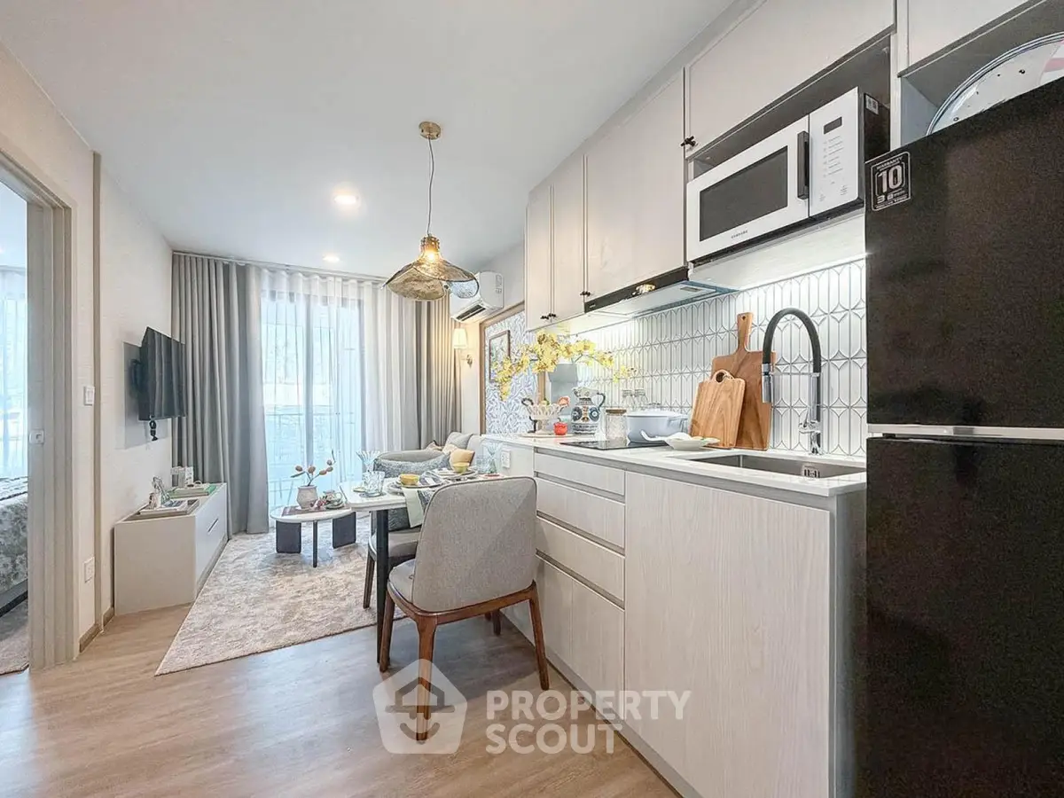 Modern open-layout kitchen and living room with stylish decor and natural light