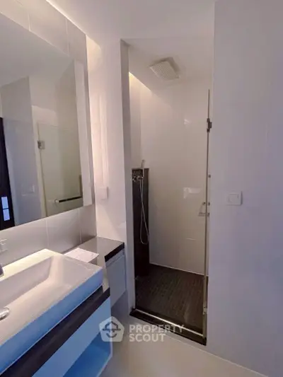 Modern bathroom with sleek shower and stylish sink area