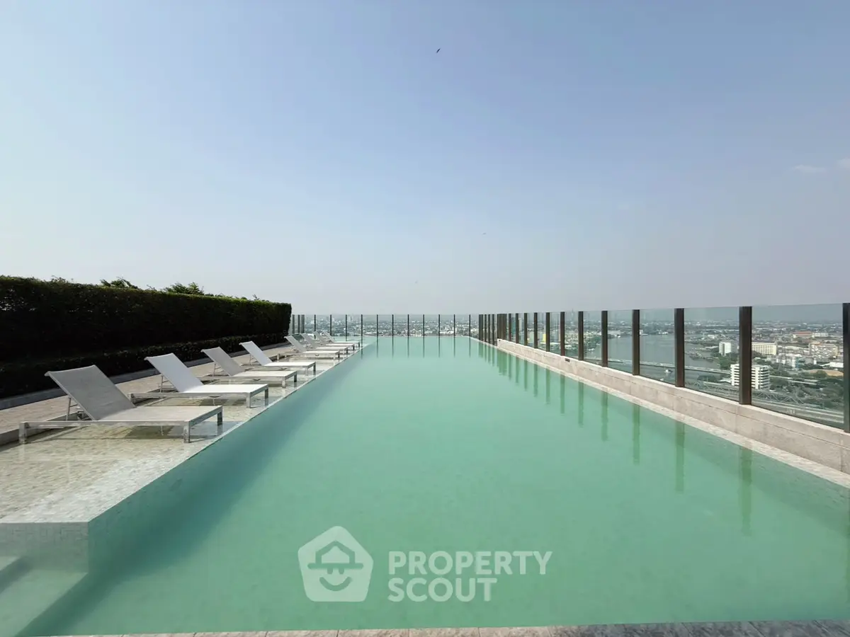 Luxurious rooftop infinity pool with stunning city skyline view