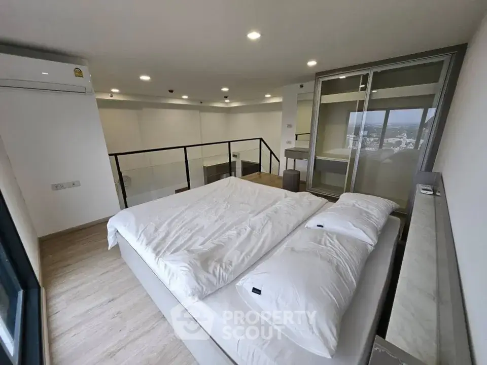 Modern loft bedroom with city view and sleek design