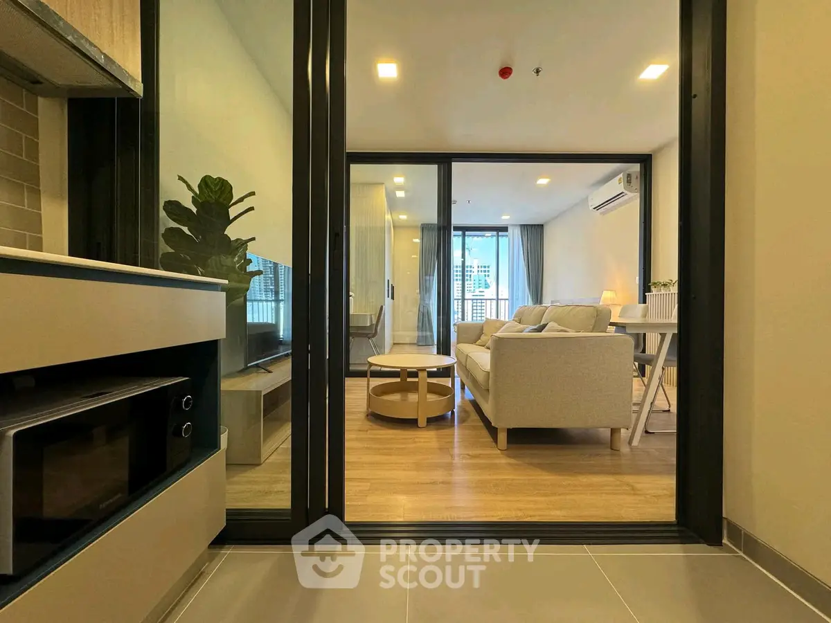 Modern living room with open layout and stylish furniture in a contemporary apartment.