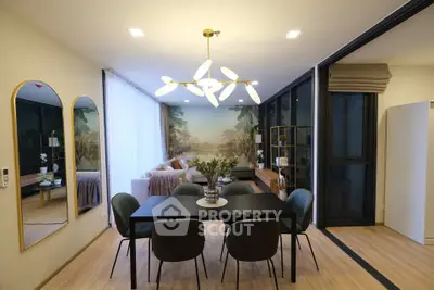 Modern dining and living area with elegant decor and large windows