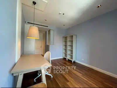 Spacious study room with wooden floors and modern lighting