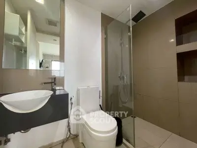 Modern bathroom with sleek design and glass shower enclosure