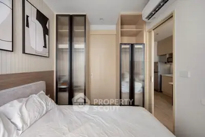 Modern bedroom with stylish decor and built-in wardrobes in a contemporary apartment.