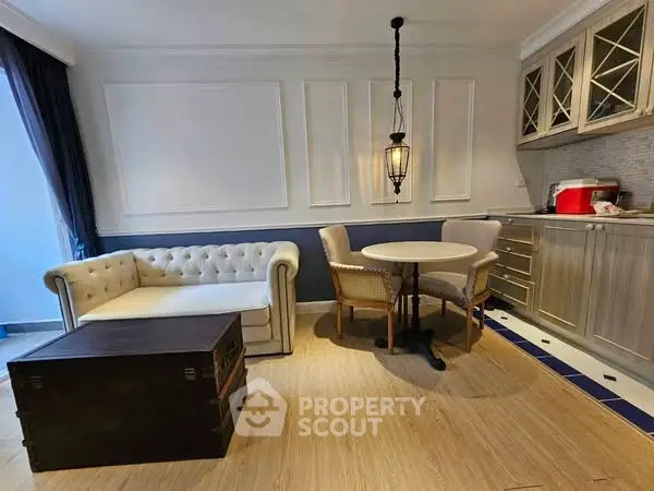 Charming living room with elegant sofa and stylish kitchen area