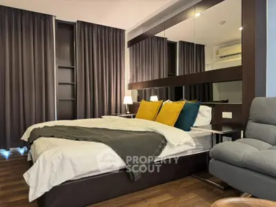 Luxurious bedroom with modern decor and cozy ambiance, featuring elegant bedding and stylish furnishings.