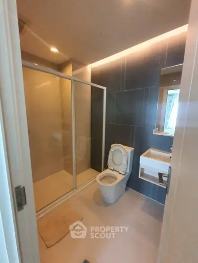 Modern bathroom with glass shower and sleek fixtures