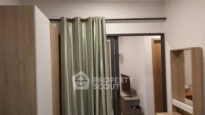 Cozy bedroom with modern wooden furniture and elegant curtains