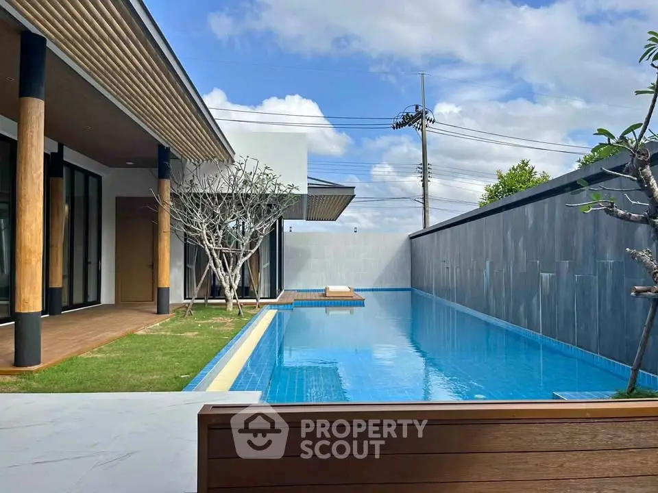 Luxurious modern villa with private pool and lush garden, perfect for relaxation and entertainment.