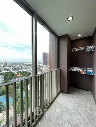 Stunning high-rise balcony with panoramic city views and ample space for relaxation.