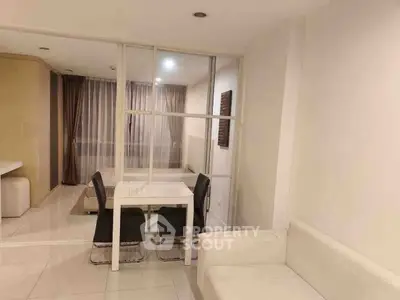 Modern minimalist living room with white sofa and dining area