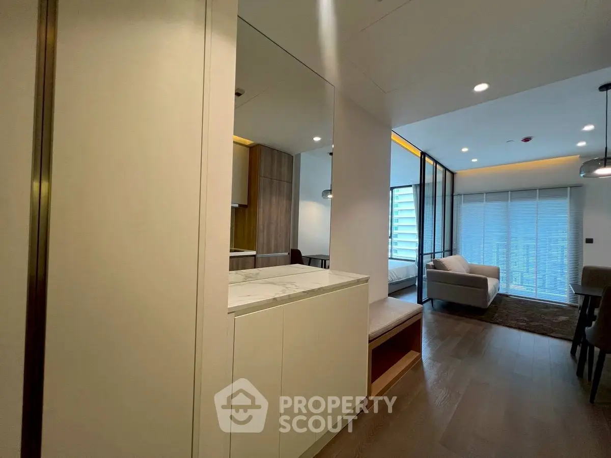 Modern open-plan living room with stylish furniture and large windows