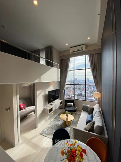Modern loft apartment with high ceilings and stunning city view, featuring stylish living area and mezzanine.