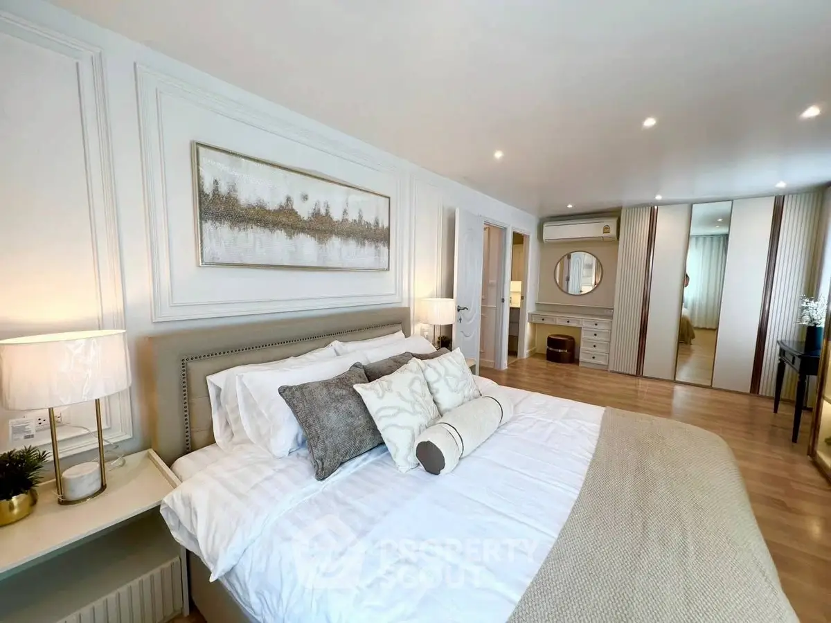 Luxurious bedroom with elegant decor and ample natural light
