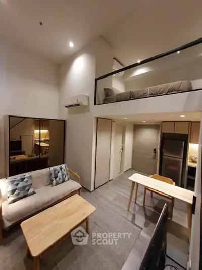 Modern loft apartment with open living area and mezzanine bedroom