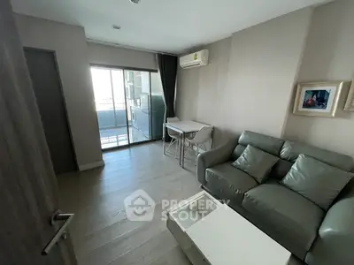 Cozy living room with modern furniture and balcony access