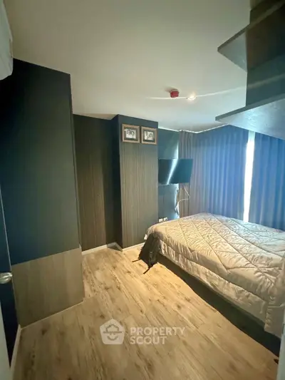 Modern bedroom with stylish decor and natural light