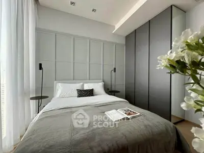 Modern bedroom with stylish decor and ample natural light