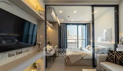 Modern studio apartment with stylish decor and large TV