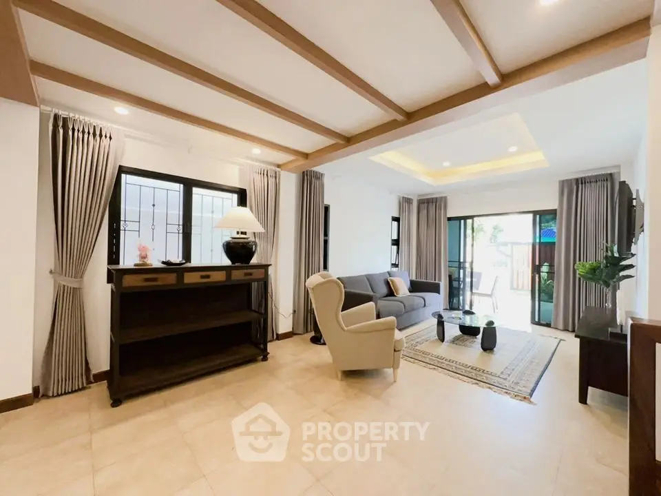 Spacious living room with elegant decor and natural light