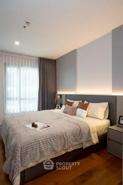 Cozy and modern bedroom with stylish decor and natural light