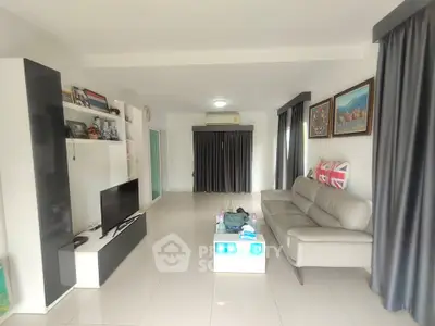 Spacious modern living room with sleek furniture and natural light