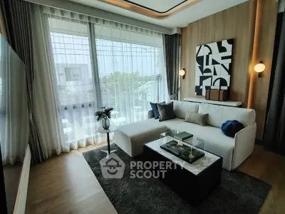 Modern living room with large windows and stylish decor