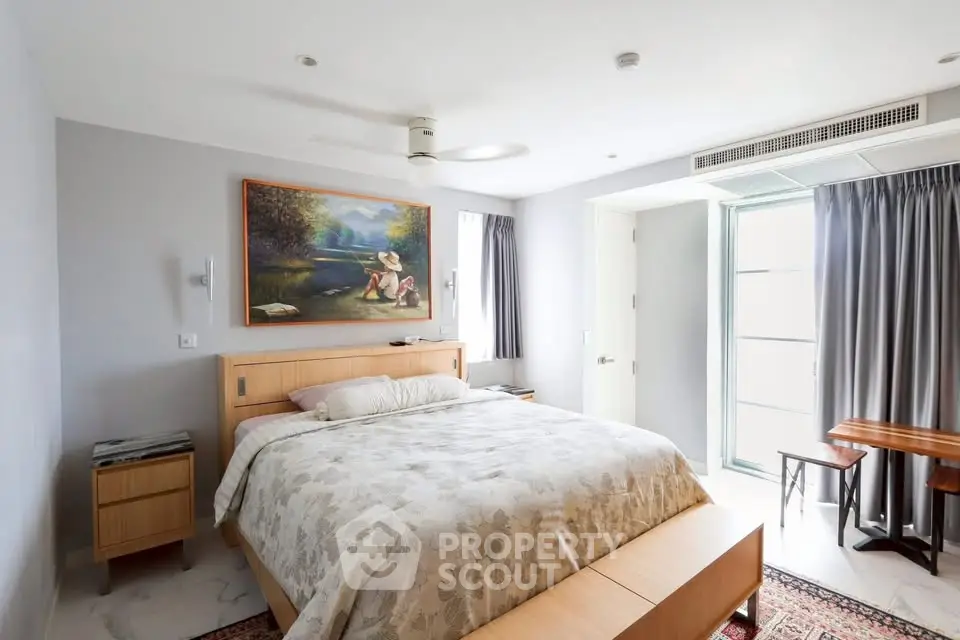 Spacious bedroom with modern decor and natural light