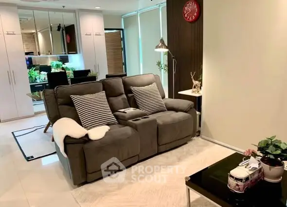 Cozy living room with plush sofa and modern decor, perfect for relaxation.