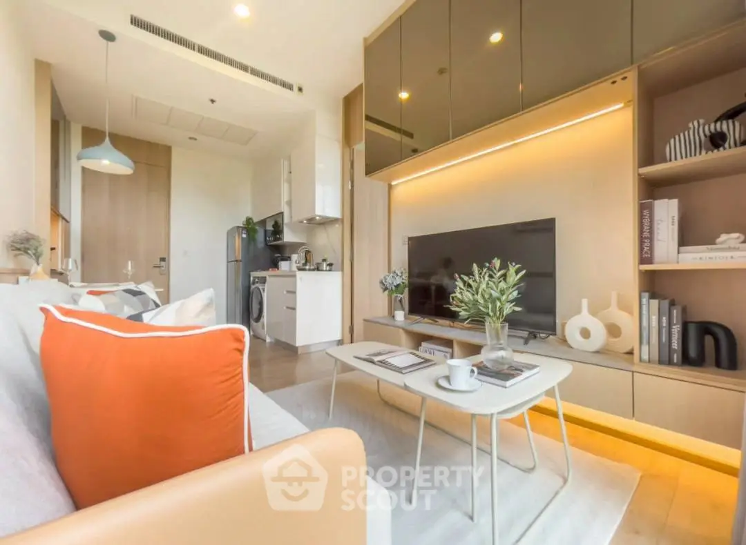 Modern living room with sleek design and open kitchen layout