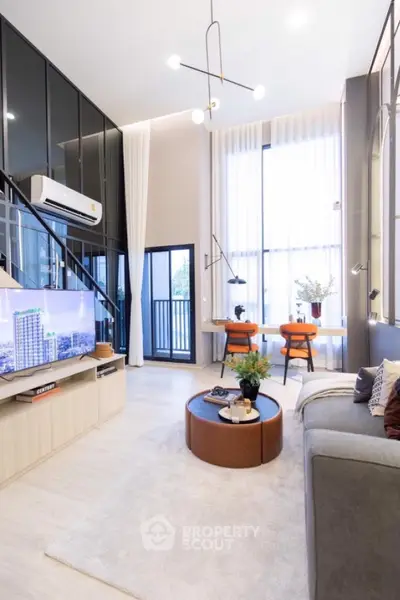 Modern loft-style living room with high ceilings and stylish decor