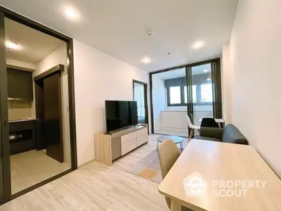 Modern living room with sleek furniture and open layout in a stylish apartment.