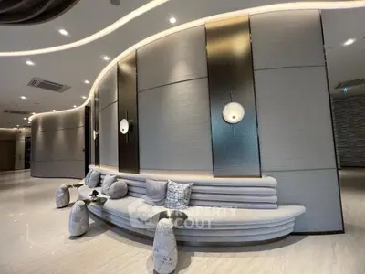 Luxurious modern lobby with elegant curved sofa and ambient lighting